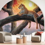 Fototapeta Leopard ležící na stromě při západu slunce.