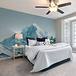 Fototapeta Zasněžené pohoří s modrou oblohou